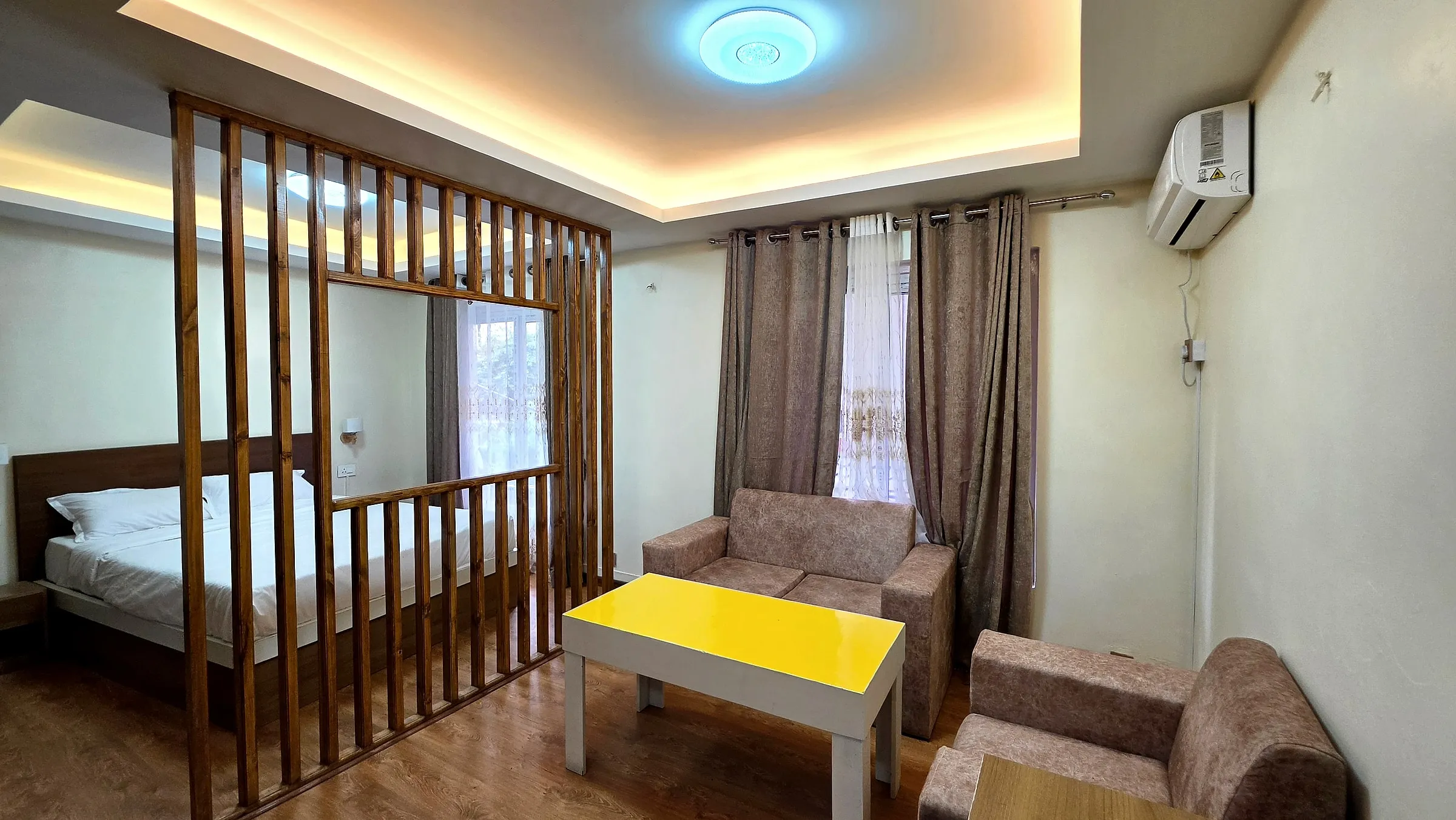 Studio living space with partition and seating